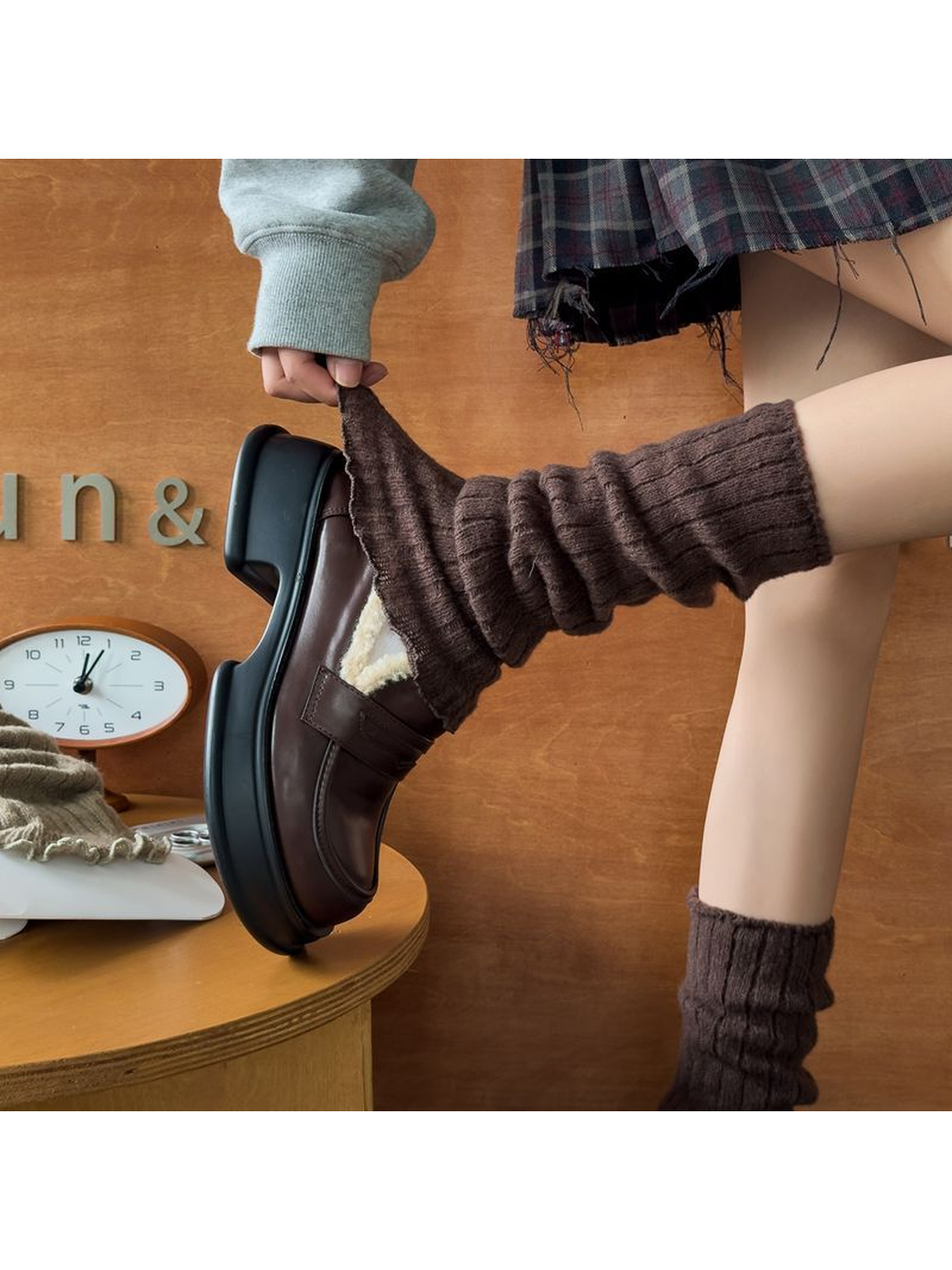 Coffee ribbed leg warmer stretched over a shoe