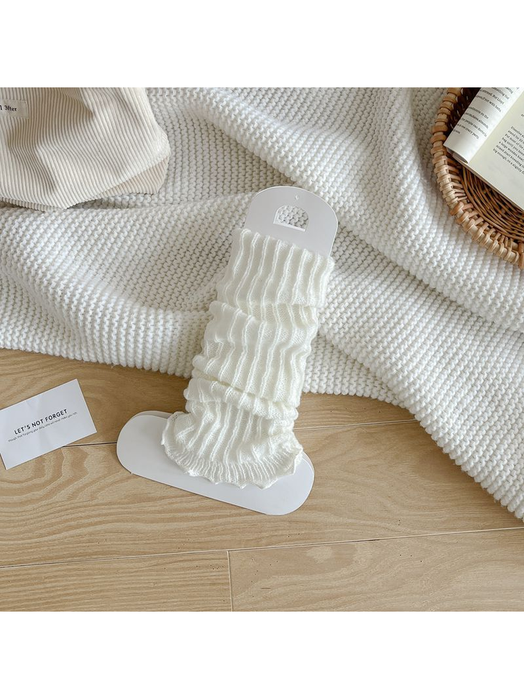 White ribbed leg warmers with a ruffled edge
