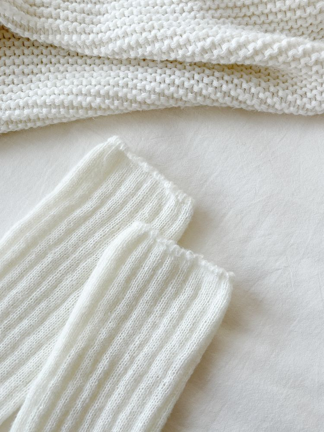 Close-up of white vertical ribbing and fuzzy texture