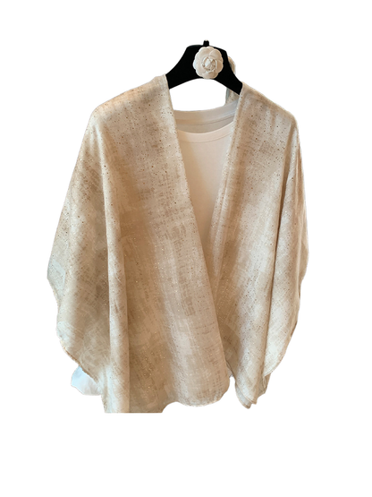 Beige rectangular scarf with metallic-look flecks displayed in an open drape