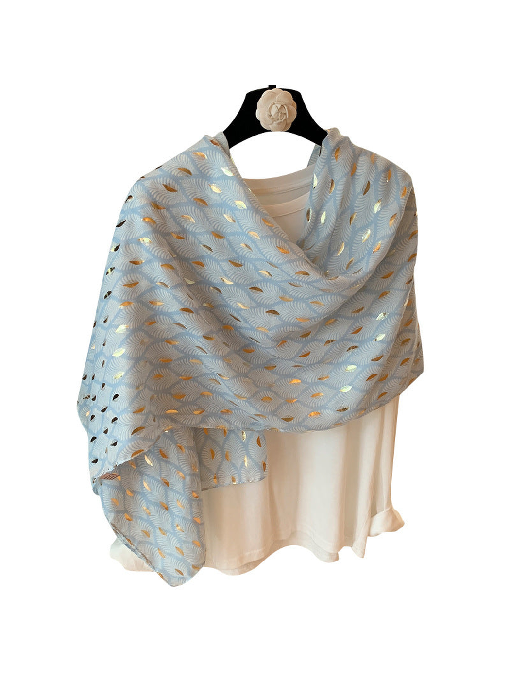 Light Blue scarf with pale frond pattern and metallic-look accents, draped on a white background