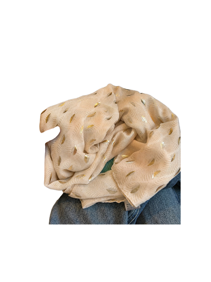 Close-up of the Beige scarf's pale frond pattern and metallic-look accents