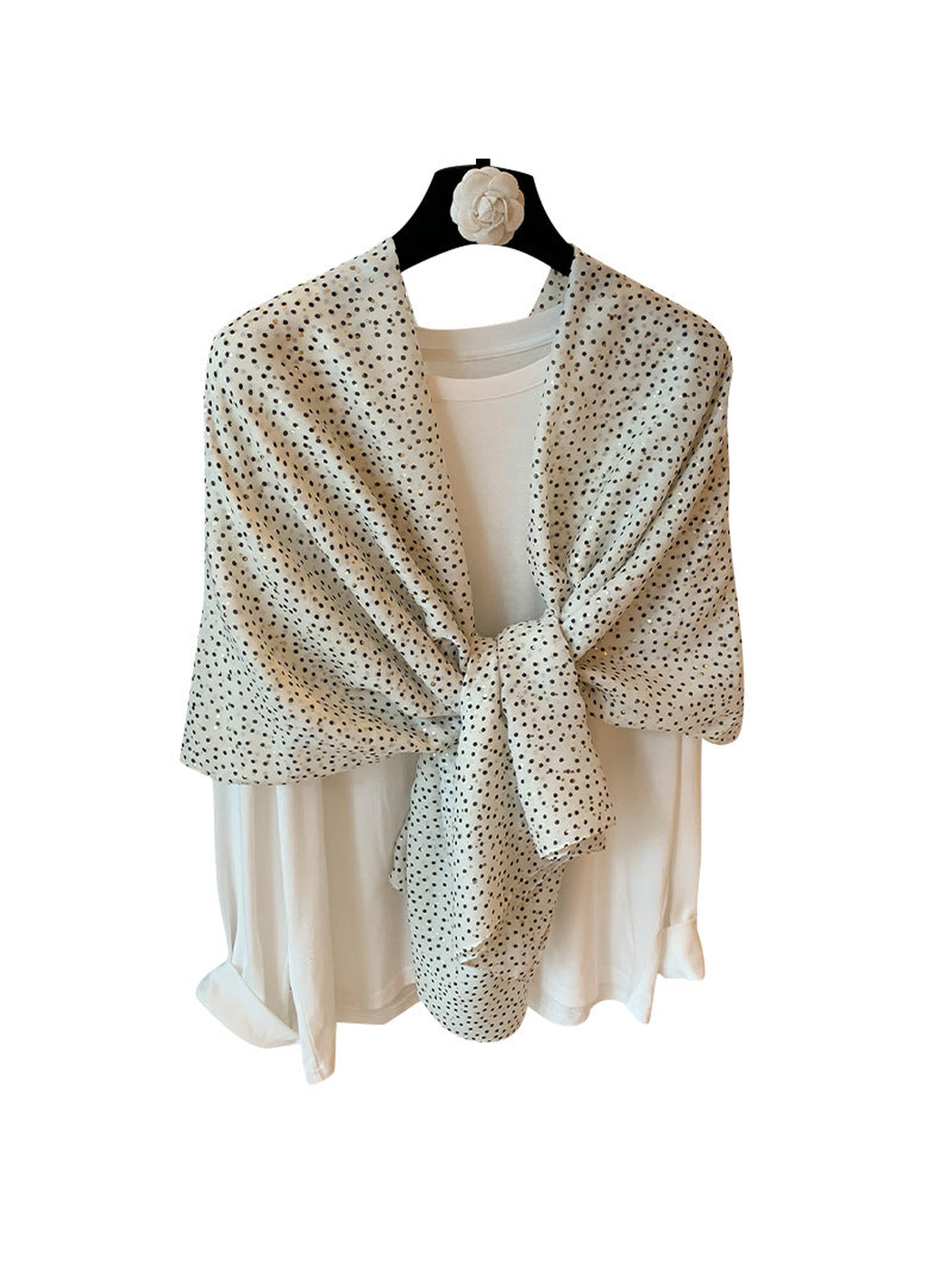 Beige scarf with scattered dot pattern in a tied draped display