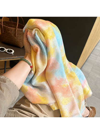 Close-up of multicolor watercolor-pattern scarf with scattered metallic-look speckles
