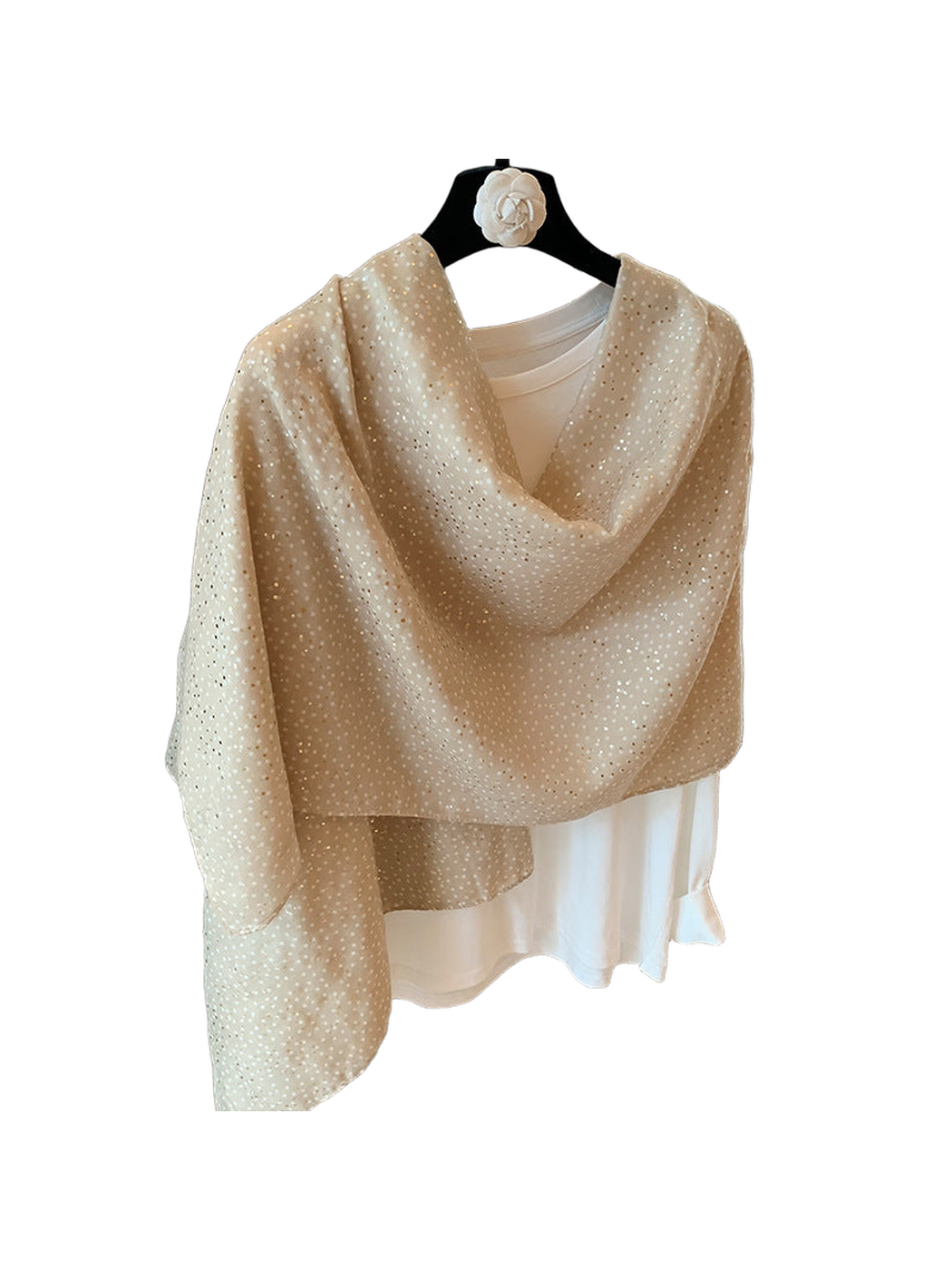 Beige dotted scarf arranged in a loose draped wrap