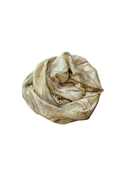 Khaki abstract-pattern scarf arranged in a dimensional loop on white