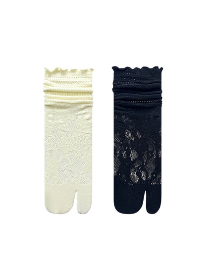 Black and ivory floral openwork split-toe socks displayed together