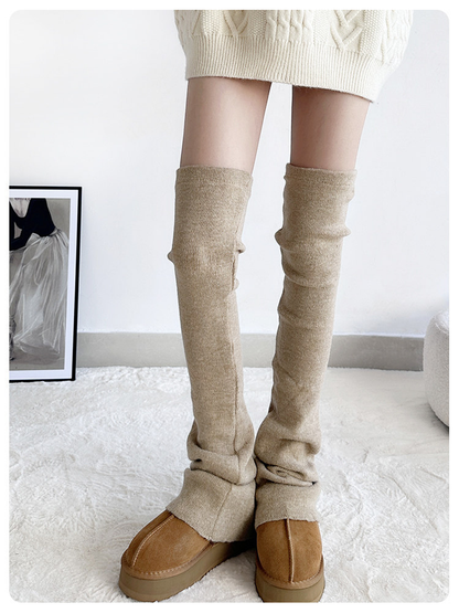 Khaki ribbed over-the-knee leg warmers worn with brown shoes, front view