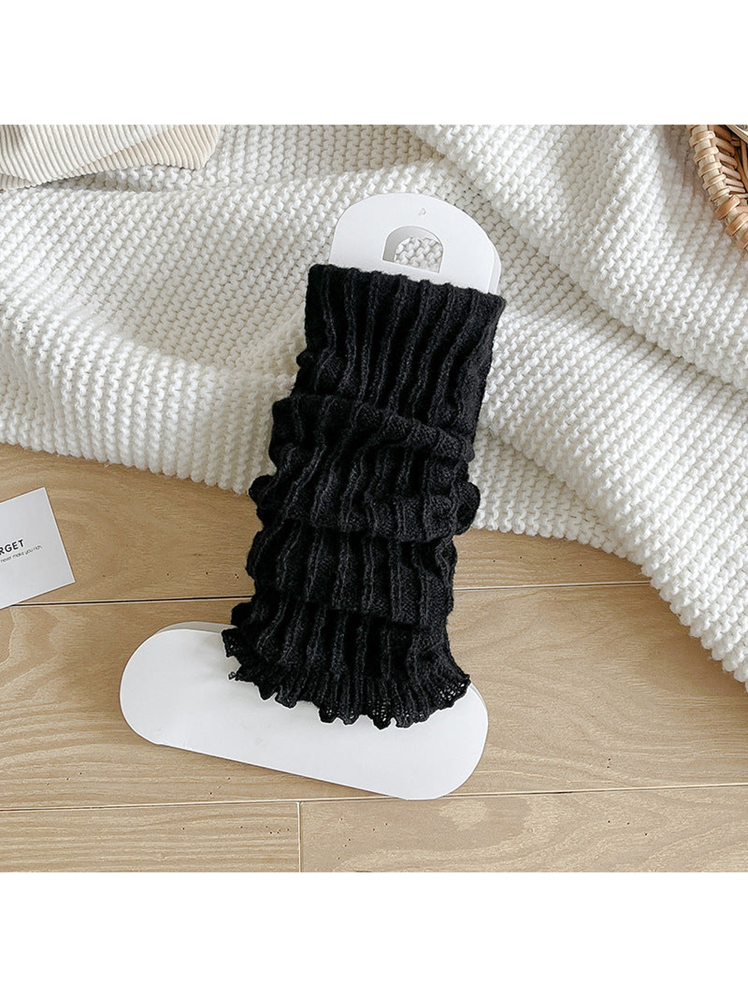 Black ribbed socks with a gathered body and ruffle edge