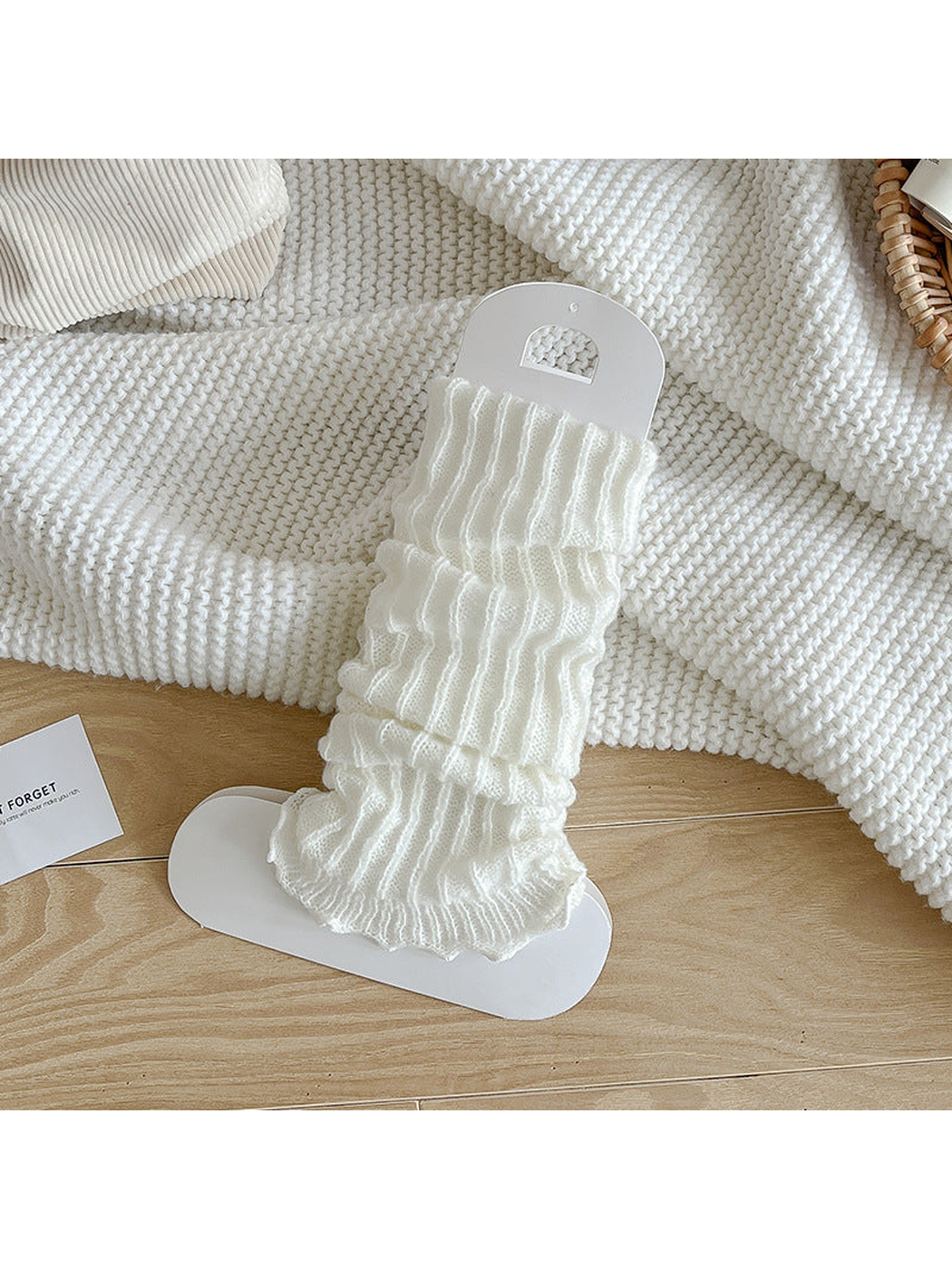 White ribbed socks with a gathered body and ruffle edge
