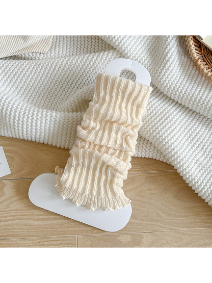 Ivory ribbed socks with a gathered body and ruffle edge