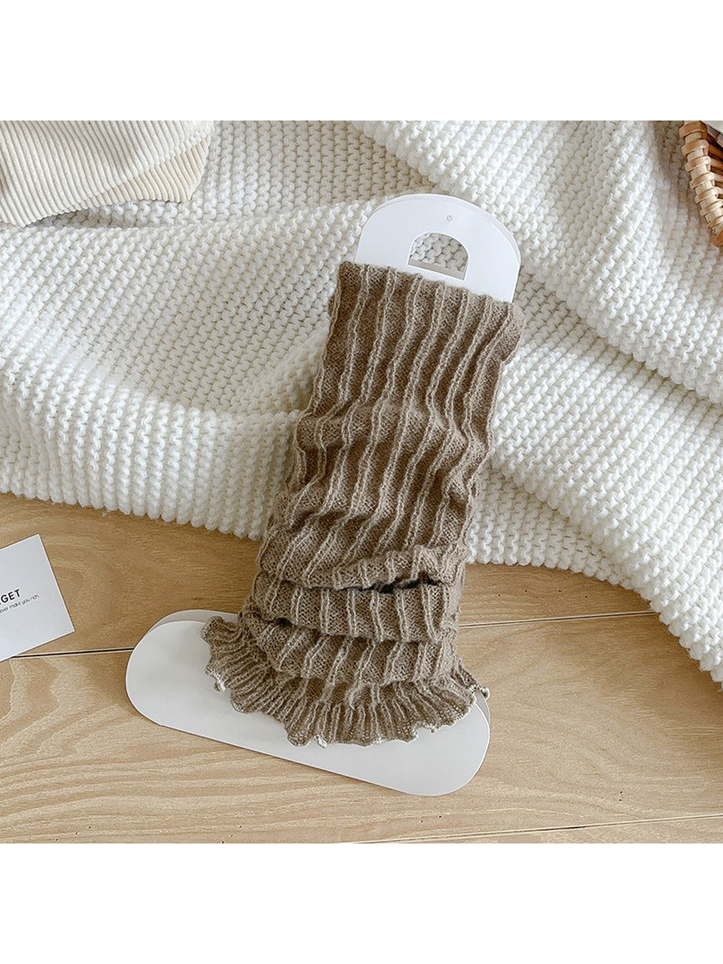 Greige ribbed socks with a gathered body and ruffle edge