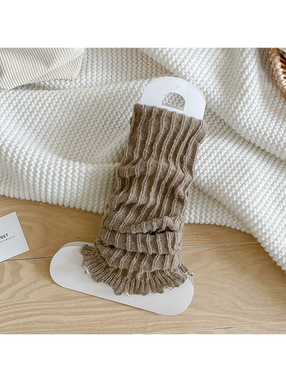 Greige ribbed socks with a gathered body and ruffle edge