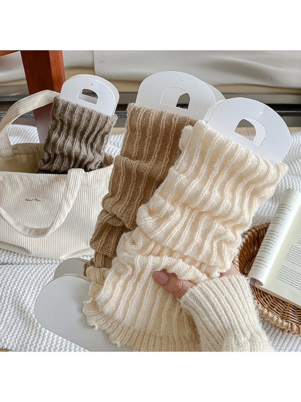 Ivory, Camel and Greige ribbed ruffle-edge socks displayed together