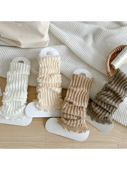 White, Ivory, Camel and Greige ribbed ruffle-edge socks displayed together
