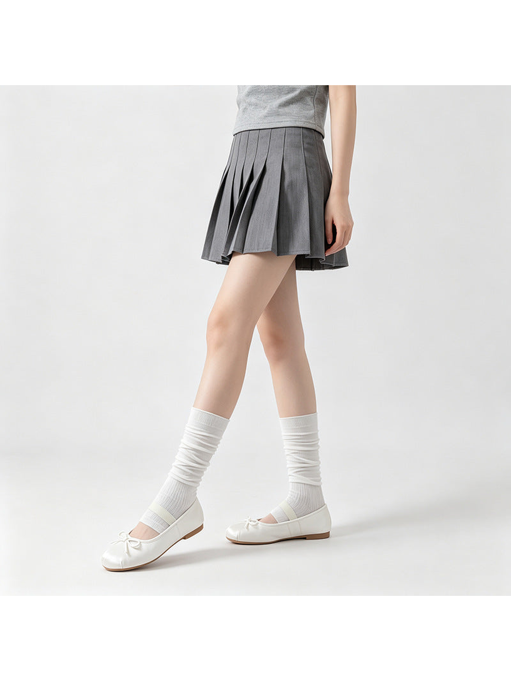 White ribbed open-toe mid-calf socks worn with ballet flats in a walking pose