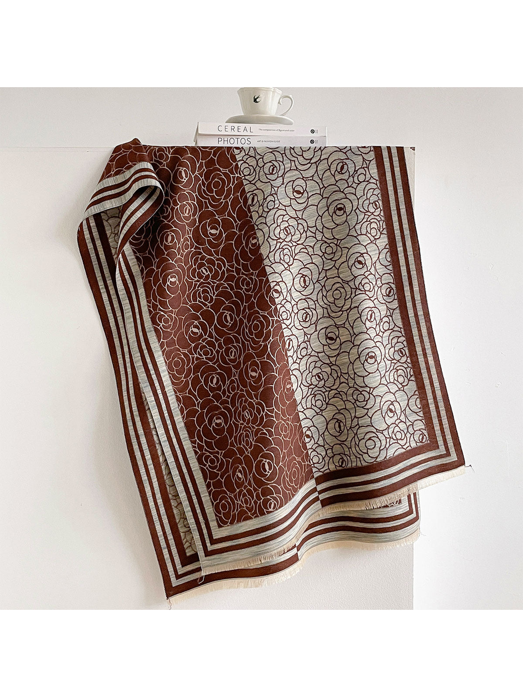 Brown / Ivory floral scarf draped to show contrasting panels, striped borders and short fringe.