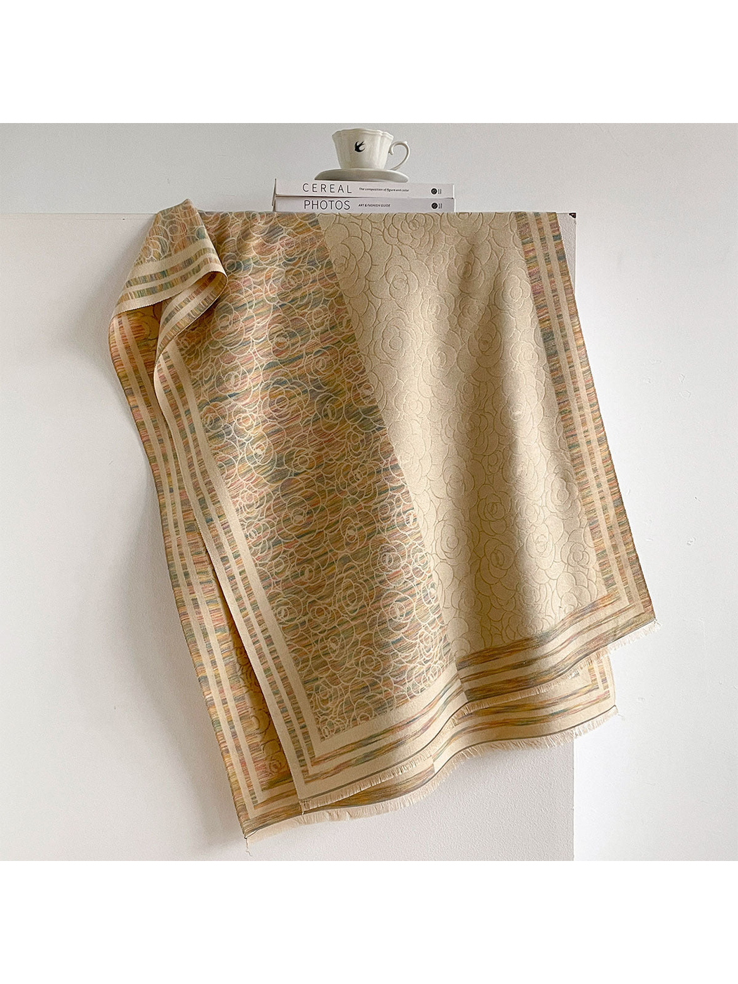 Multicolor floral scarf with cream panels, muted colored striations, striped borders and short fringe.