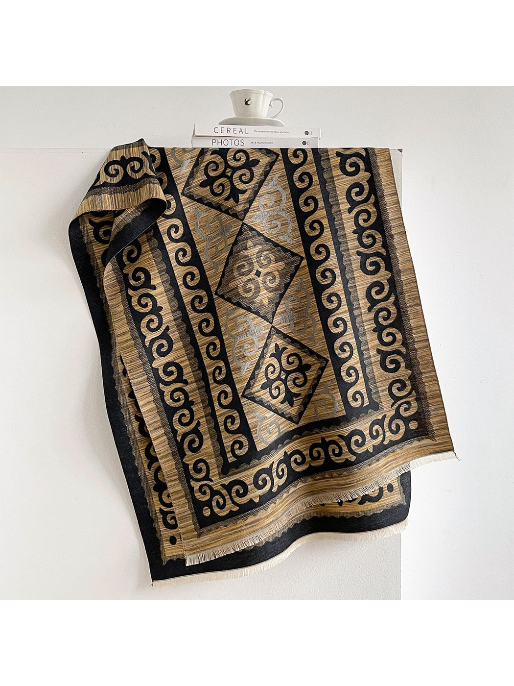 Black / Gold scarf draped open with scroll borders, diamond medallions, and short fringe.