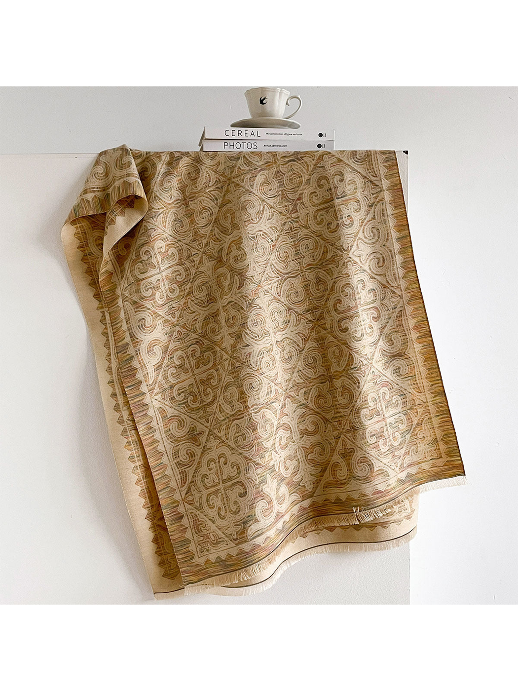 Khaki ornamental scarf with geometric border and fringed ends