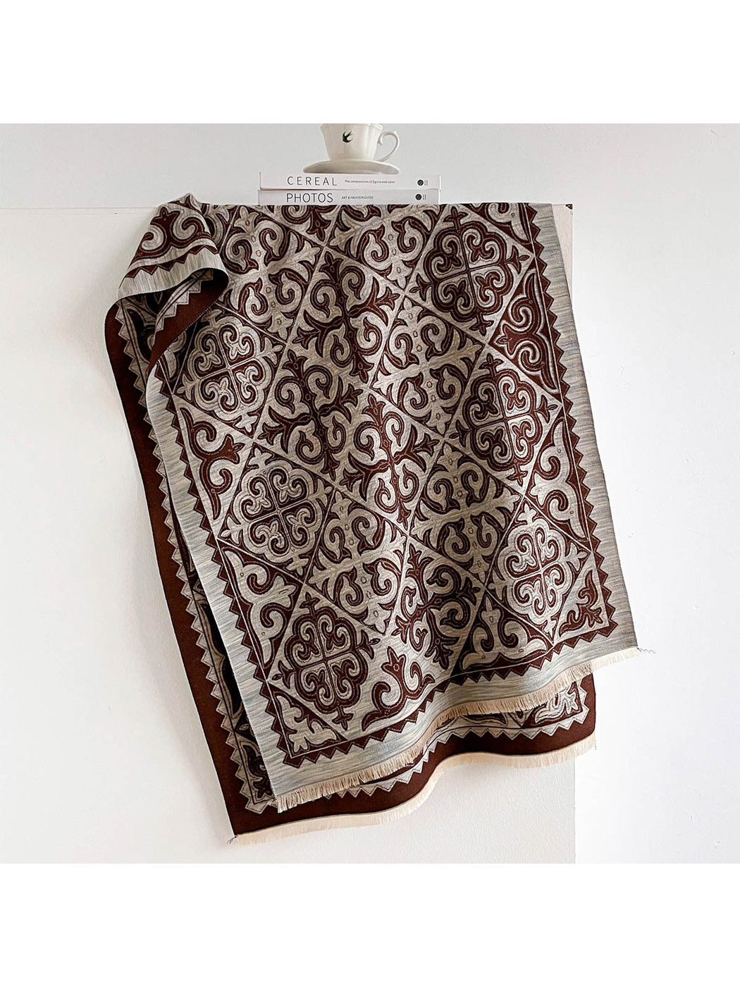 Coffee ornamental scarf with geometric border and fringed ends