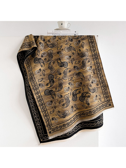 Gold paisley scarf with black border and short fringe
