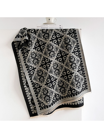 Black Gray scarf draped open with alternating floral diamonds and black scroll motifs, a contrasting border and short fringe.