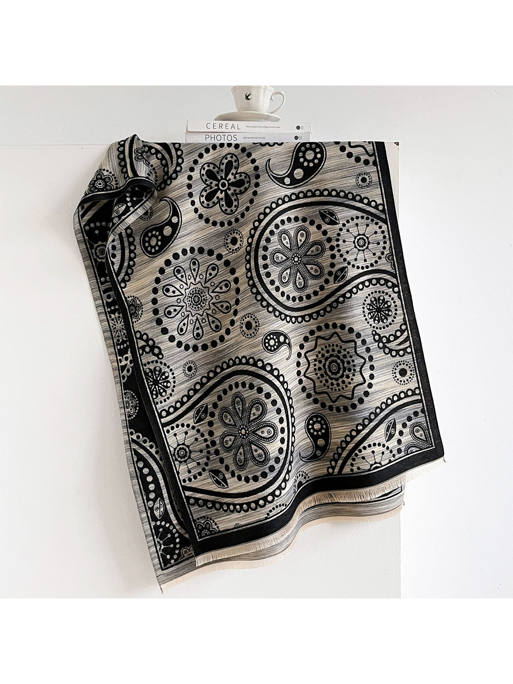 Black Gray paisley scarf draped to show floral medallions, a black border and short fringe.