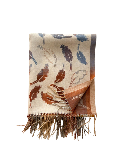 Folded Cream feather-pattern scarf showing its contrasting underside, border and twisted fringe beside a beige coat.
