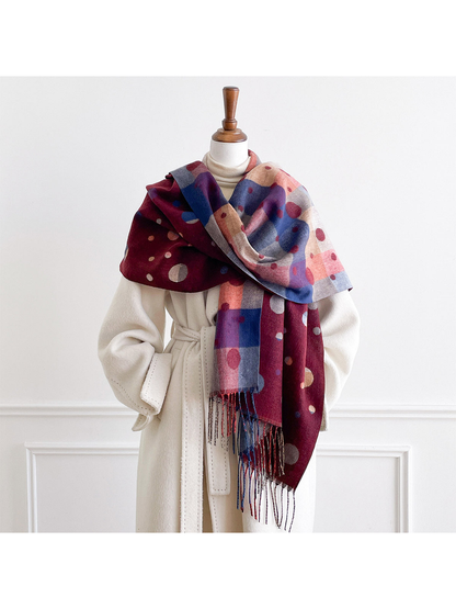 Burgundy scarf wrapped around a mannequin's shoulders, showing polka dots and the color block reverse.