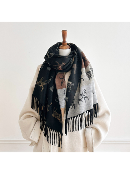 Black horse motif scarf looped around a mannequin's neck, with both fringed ends and the contrasting reverse visible.