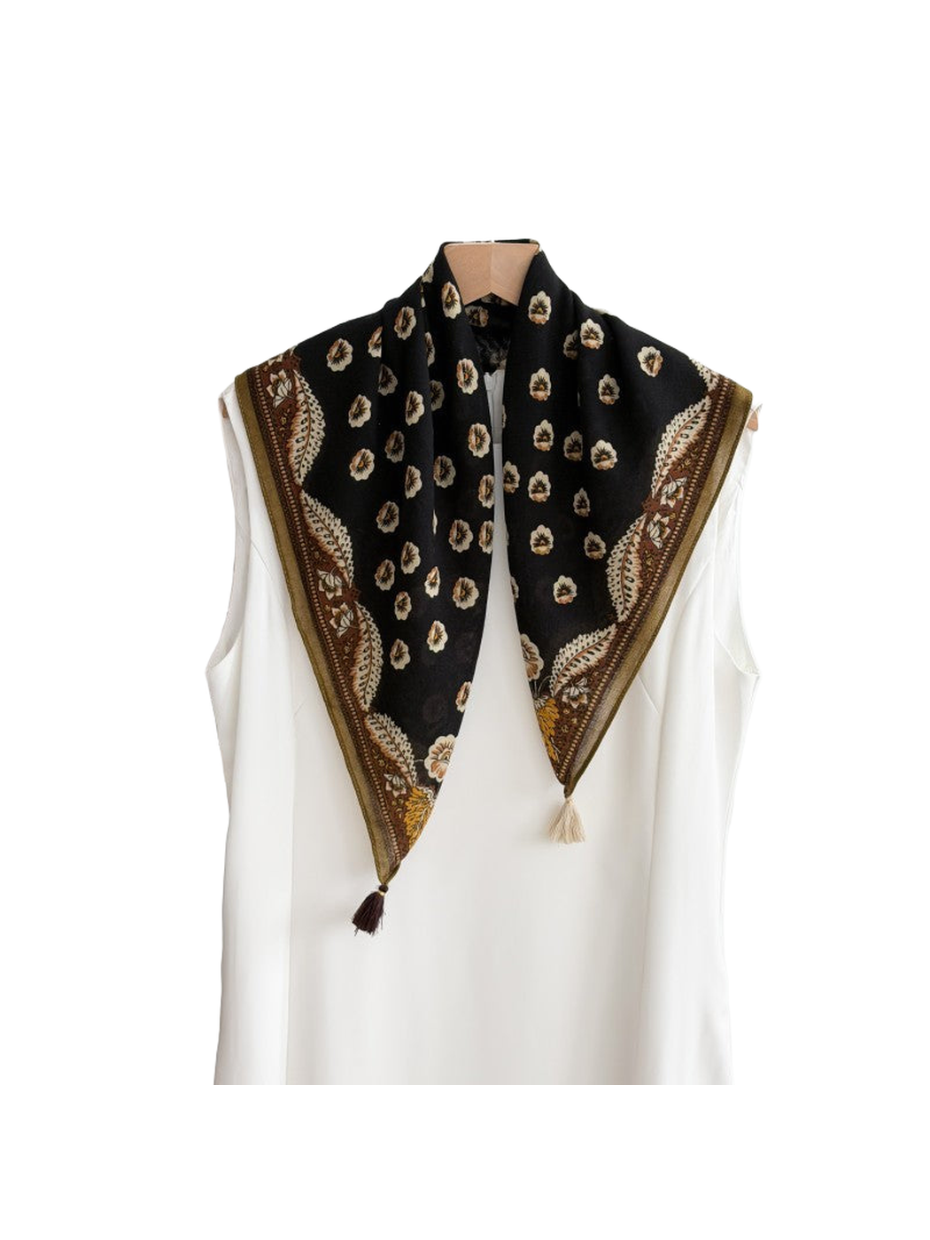 Black floral scarf with an ornamental brown border and contrasting corner tassels in a draped view.