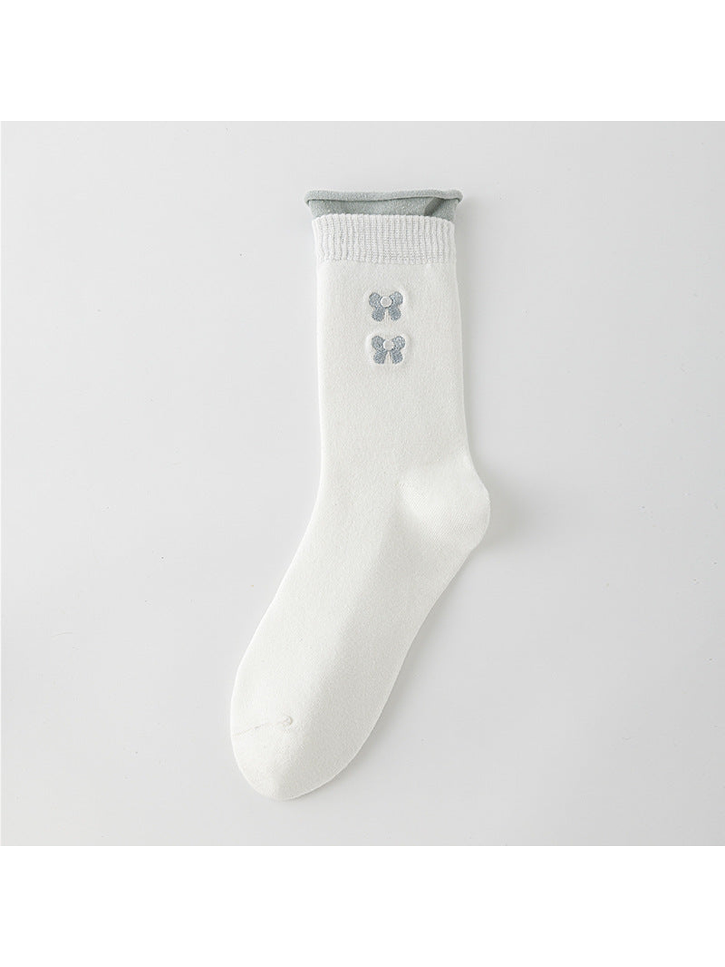 White crew sock with a gray rolled upper edge and two gray bow motifs.