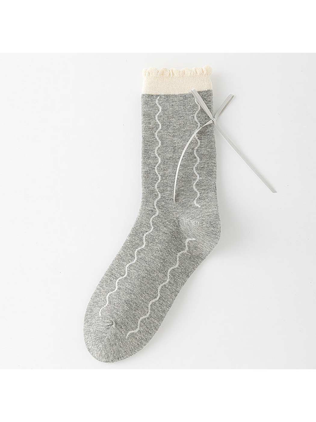Waves crew sock in gray with pale wavy lines, a ribbon bow, and a scalloped ivory cuff.