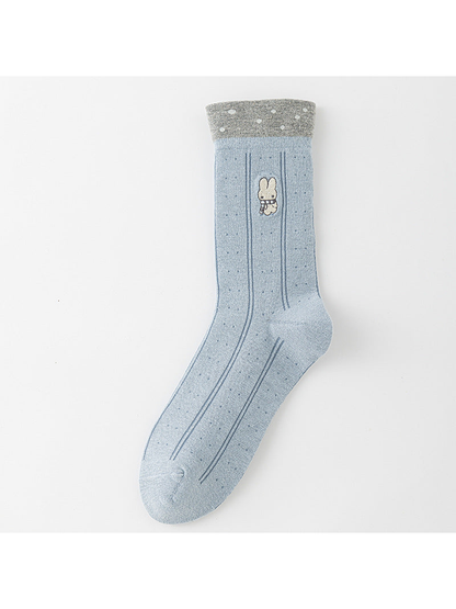 Rabbit crew sock in light blue with vertical stripes, small dots, and a contrasting gray cuff.