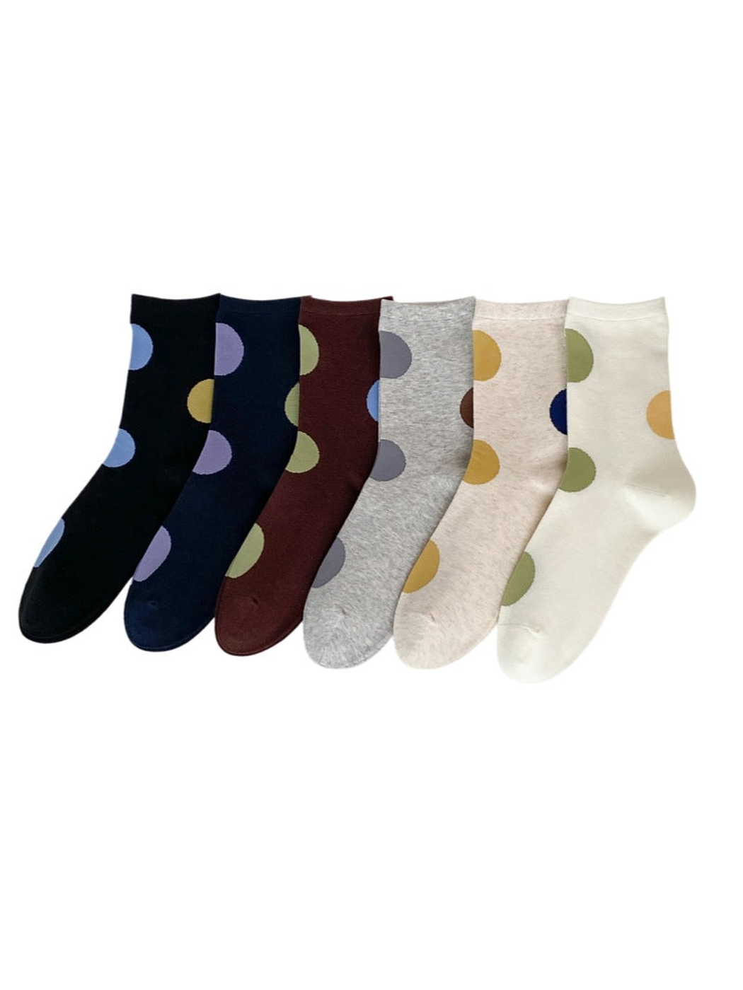 Oversized polka dot crew socks in Black, Navy, Dark Brown, Heather Gray, Beige, and Ivory on a white background.