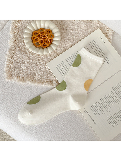 Ivory crew sock with oversized light green and mustard yellow dots.