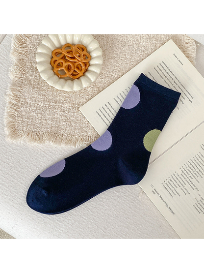 Navy crew sock with oversized light purple and light green dots.