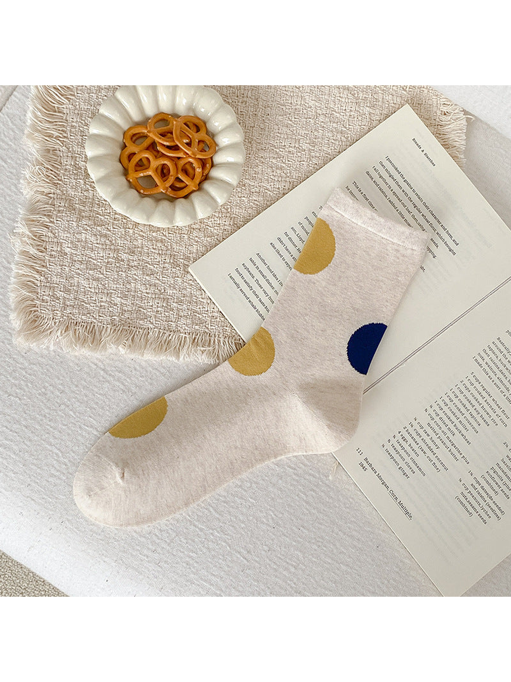 Beige crew sock with oversized mustard yellow and navy dots.