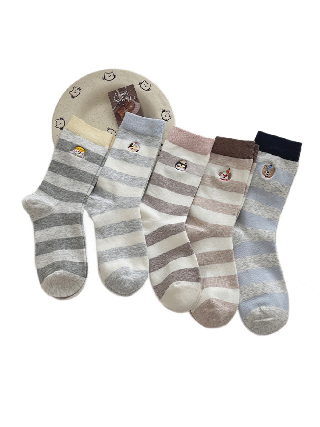 Striped crew socks in five colorways with contrasting cuffs and embroidered animal motifs.