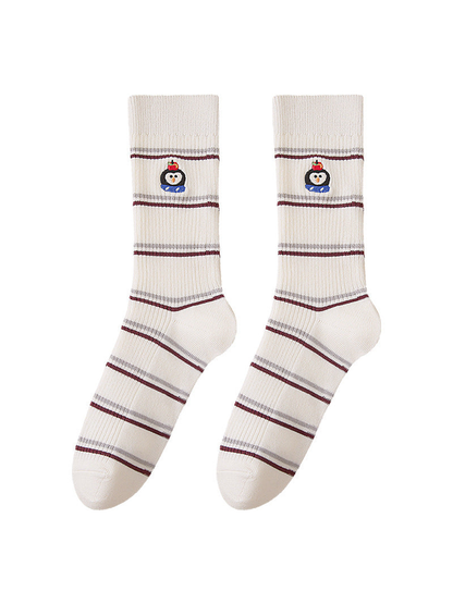 Penguin striped socks with ribbed cuffs and embroidered motifs, full front view.