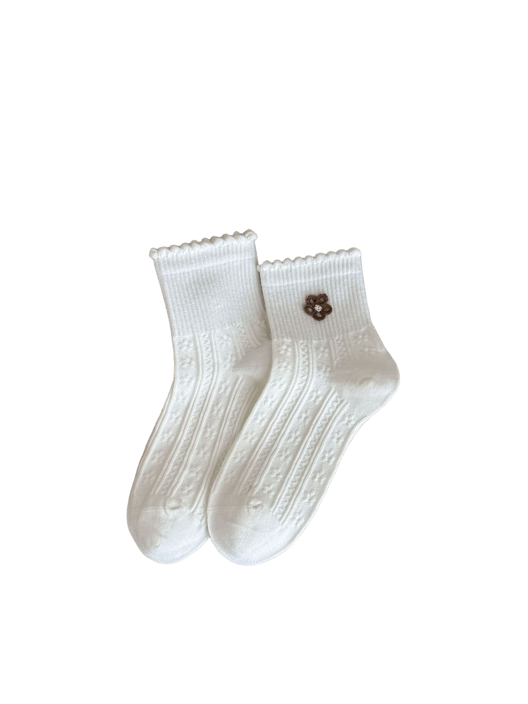 White socks with brown flower appliqué, ruffled cuffs and vertical textured panels.