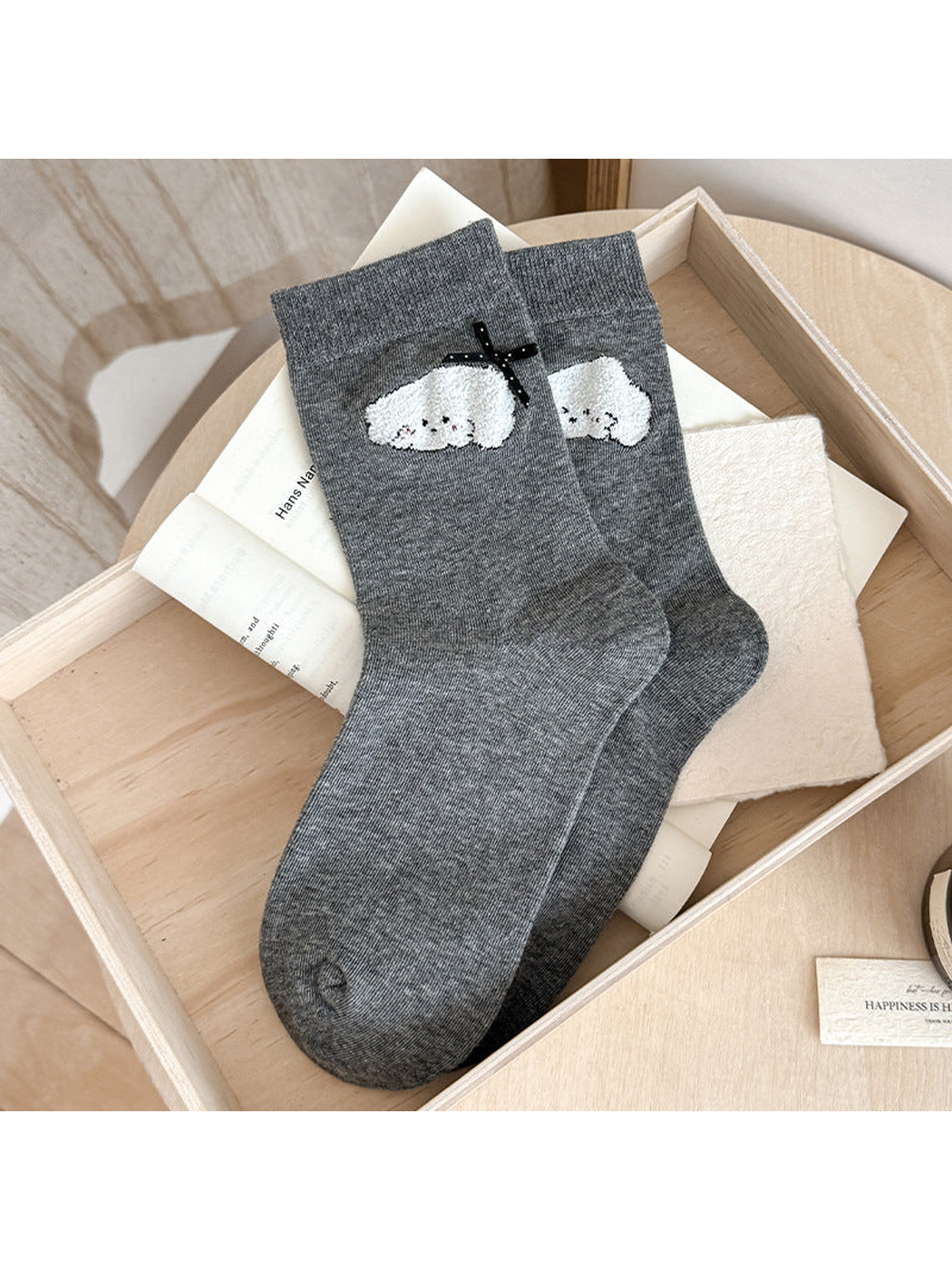 Gray Cartoon Applique socks with fuzzy white character decorations and a black ribbon bow.