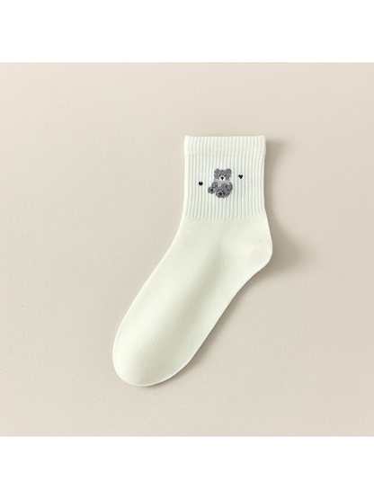 Ivory Bear crew sock with a gray bear motif between small dark accents.