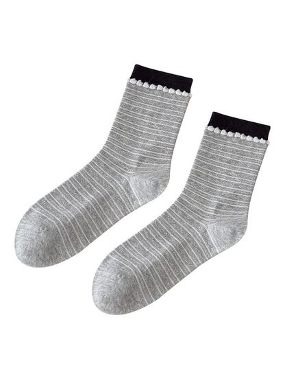 Gray Stripes socks with black cuffs and white loop trim on a white background.