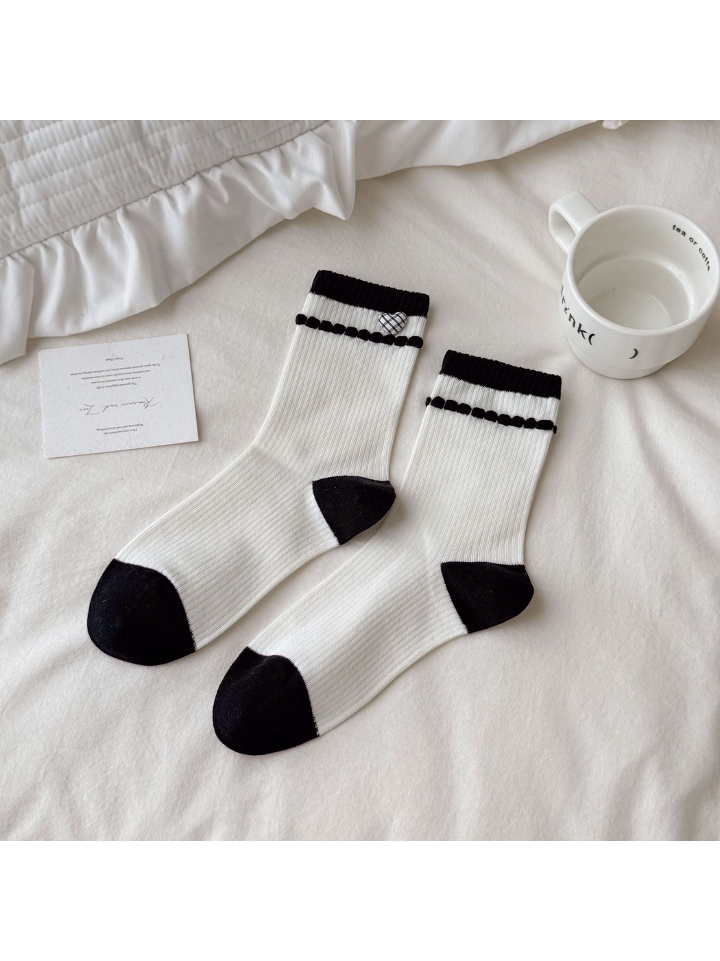 Ivory Heart socks with a plaid heart accent, black cuff bands, and contrasting heels and toes.