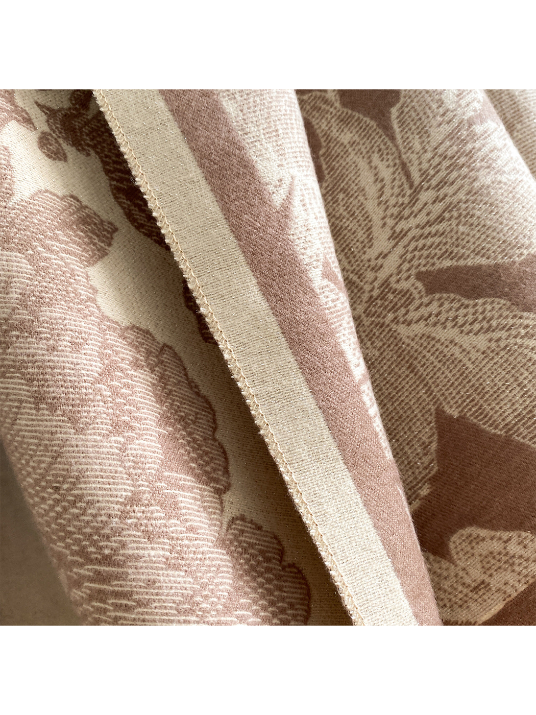 Close-up of the Coffee scarf's cream border, edge stitching, and fine floral texture.
