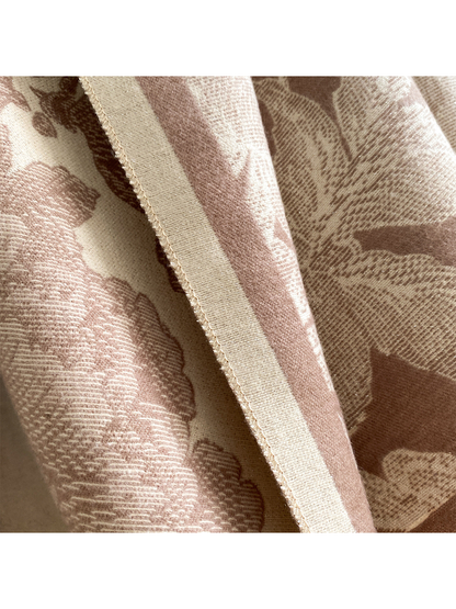Close-up of the Coffee scarf's cream border, edge stitching, and fine floral texture.