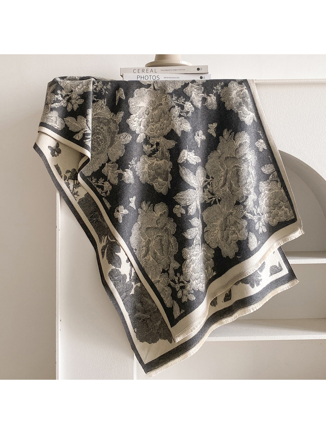 Dark Gray scarf draped to reveal cream floral and butterfly motifs, bordered edges, and short fringe.