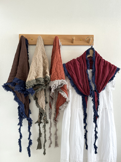 Dark Brown, Khaki, Orange Red and Burgundy scarves hanging together with contrasting frayed borders.